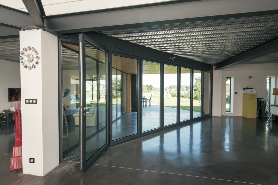 Reynaers bifold doors showing the CF77 model in a house lobby