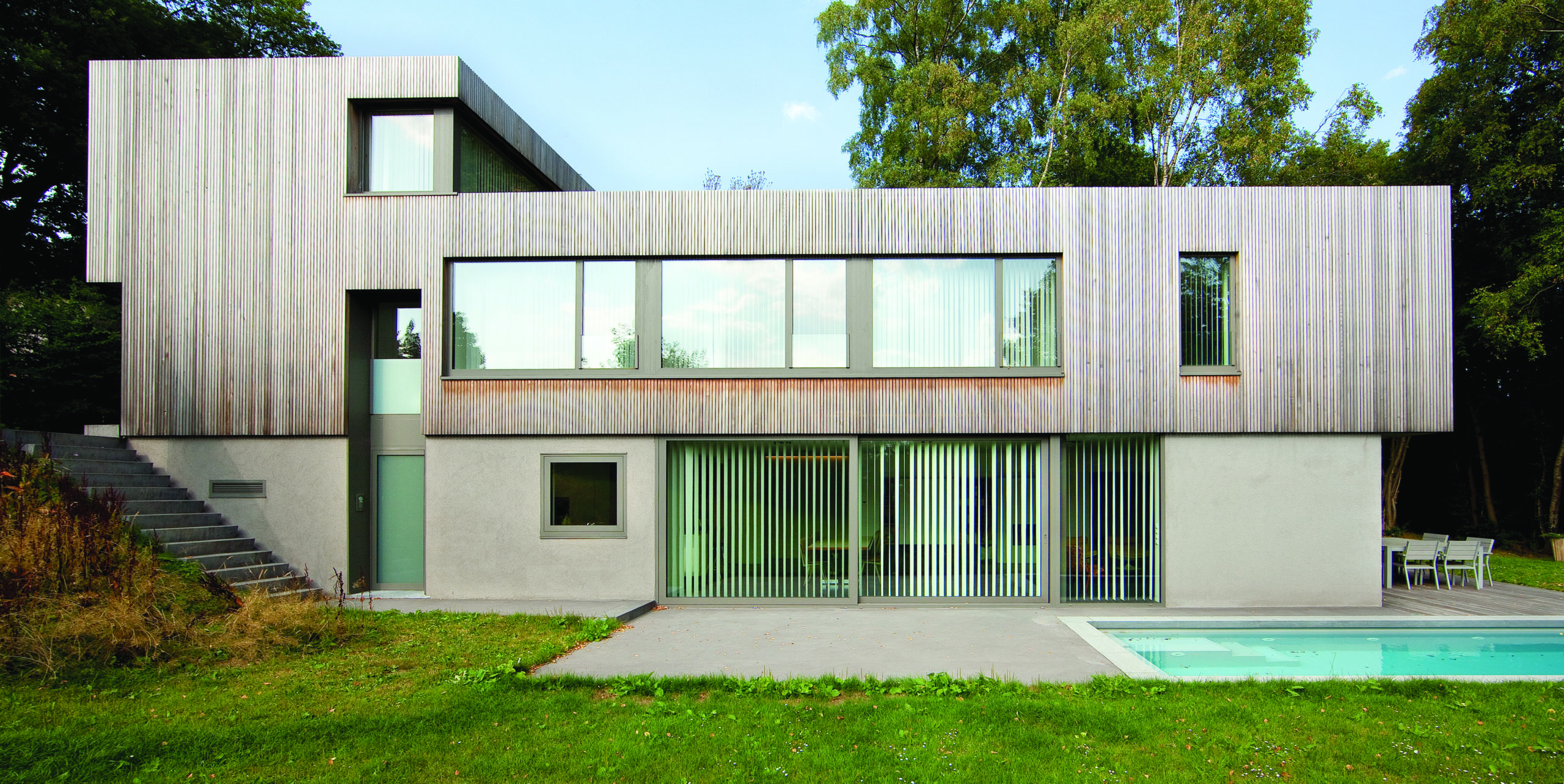 luxury home with bronze reynaers aluminium cp155 sliding doors