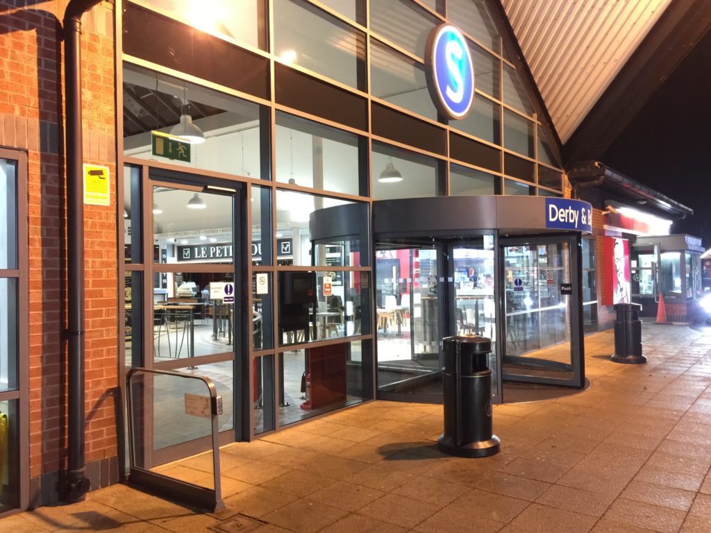 commercial aluminium windows and doors in a motorway services at night