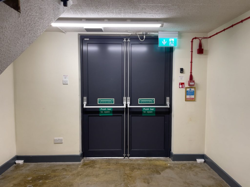 aluminium fire exit doors in a hotel stairwell