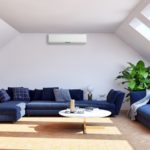 flat rooflight in a new white lounge with blue sofas